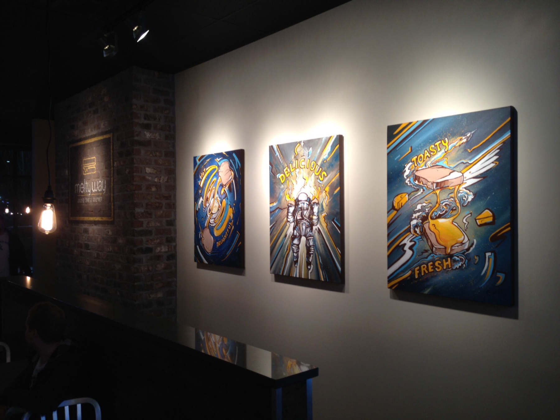 The Melty Way restaurant, three paintings installed on the wall