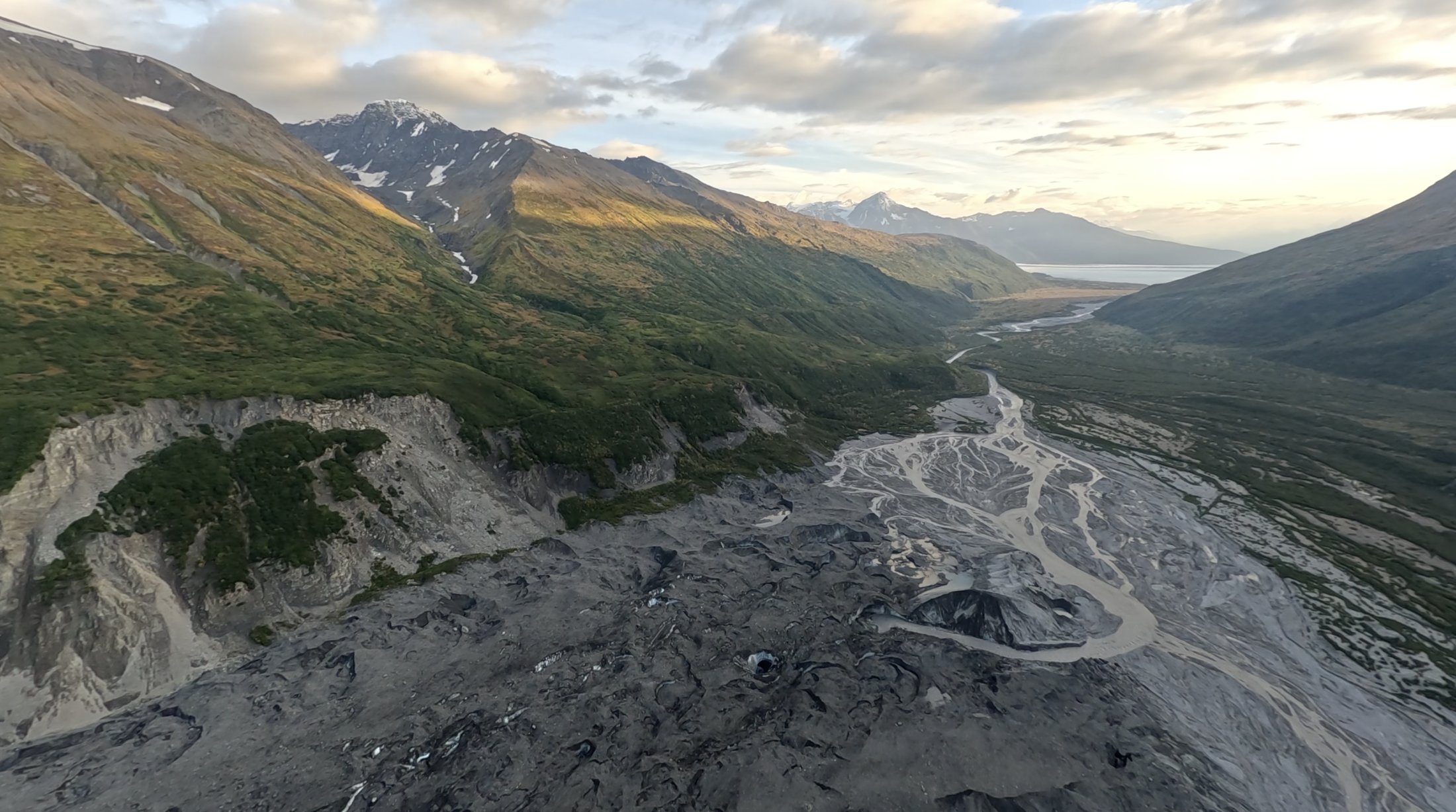 Aerial view of a mountain valley at golden hour, Alaska