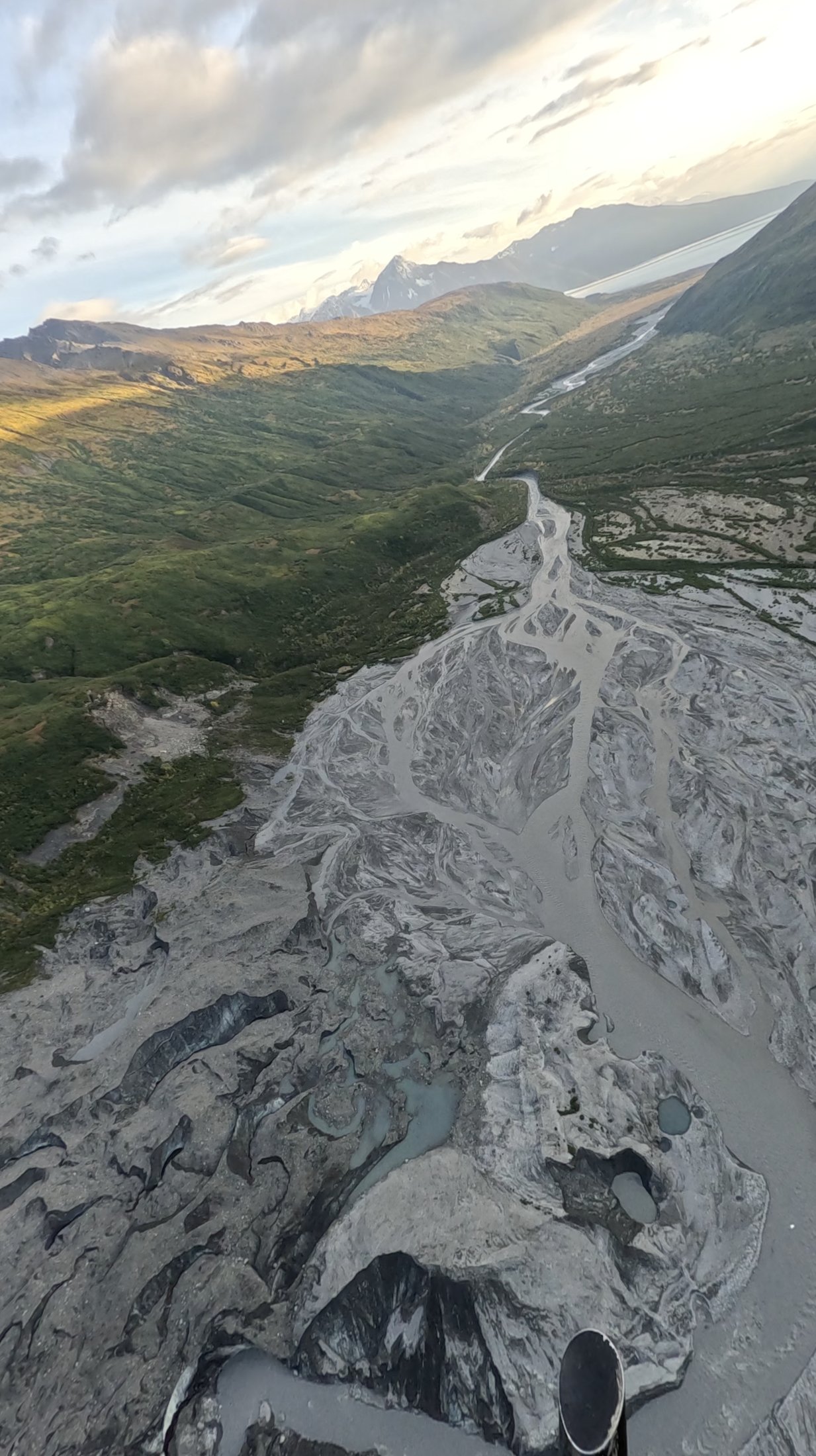 Aerial view of a glacier and braided river, Alaska