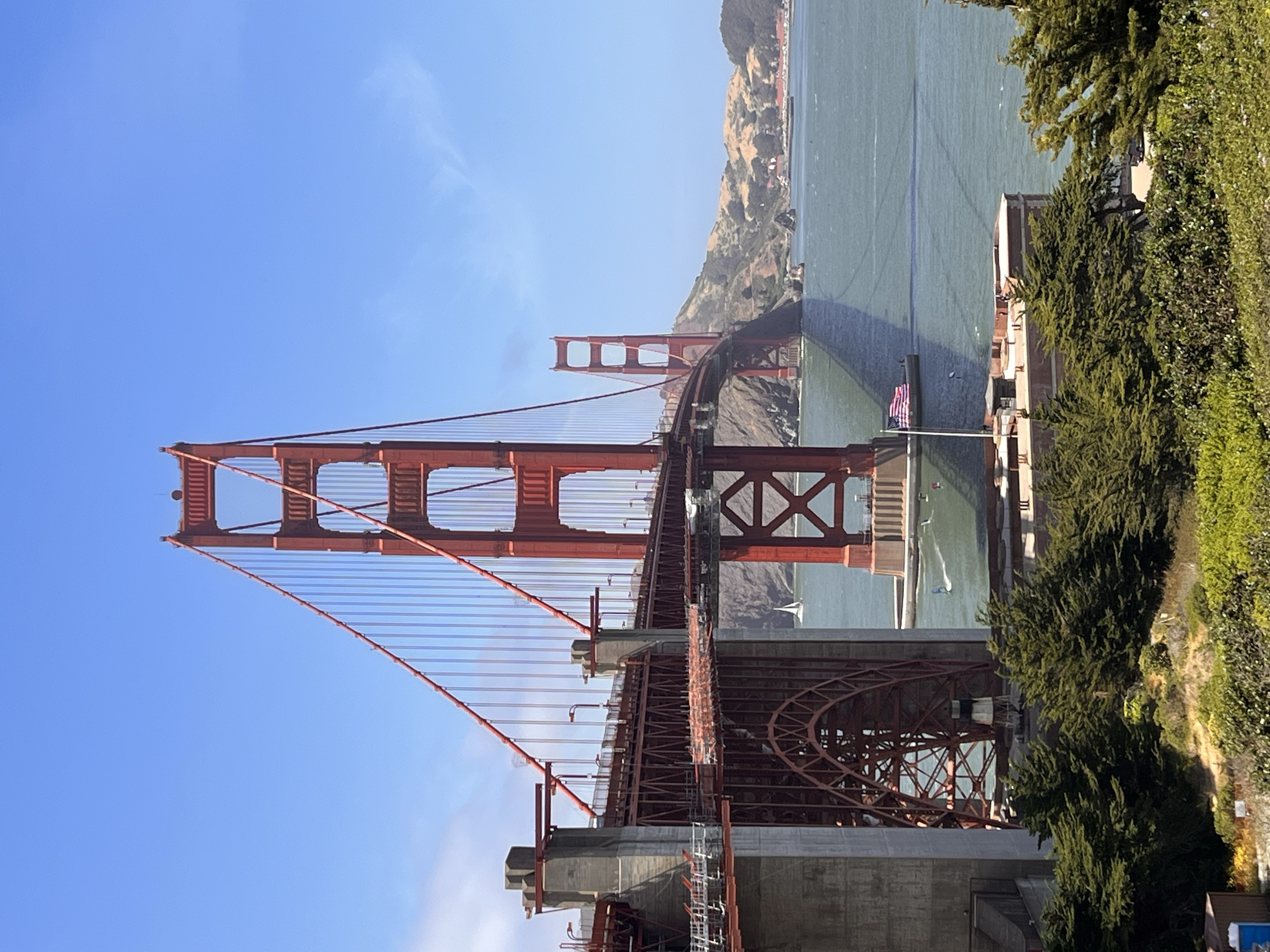 The Golden Gate Bridge towers against a clear blue sky